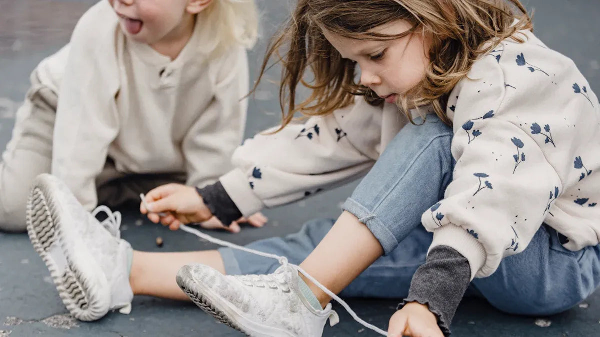 7 Signs Your Toddler is Ready to Learn Buttons, Zippers, and Laces